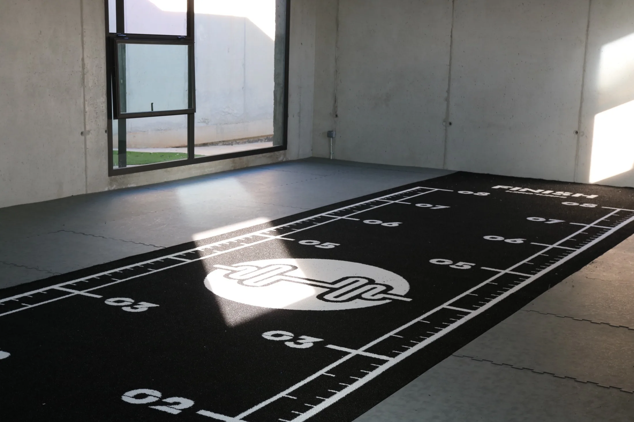 Heroturfs sports turf track delivered and laid out in a gym